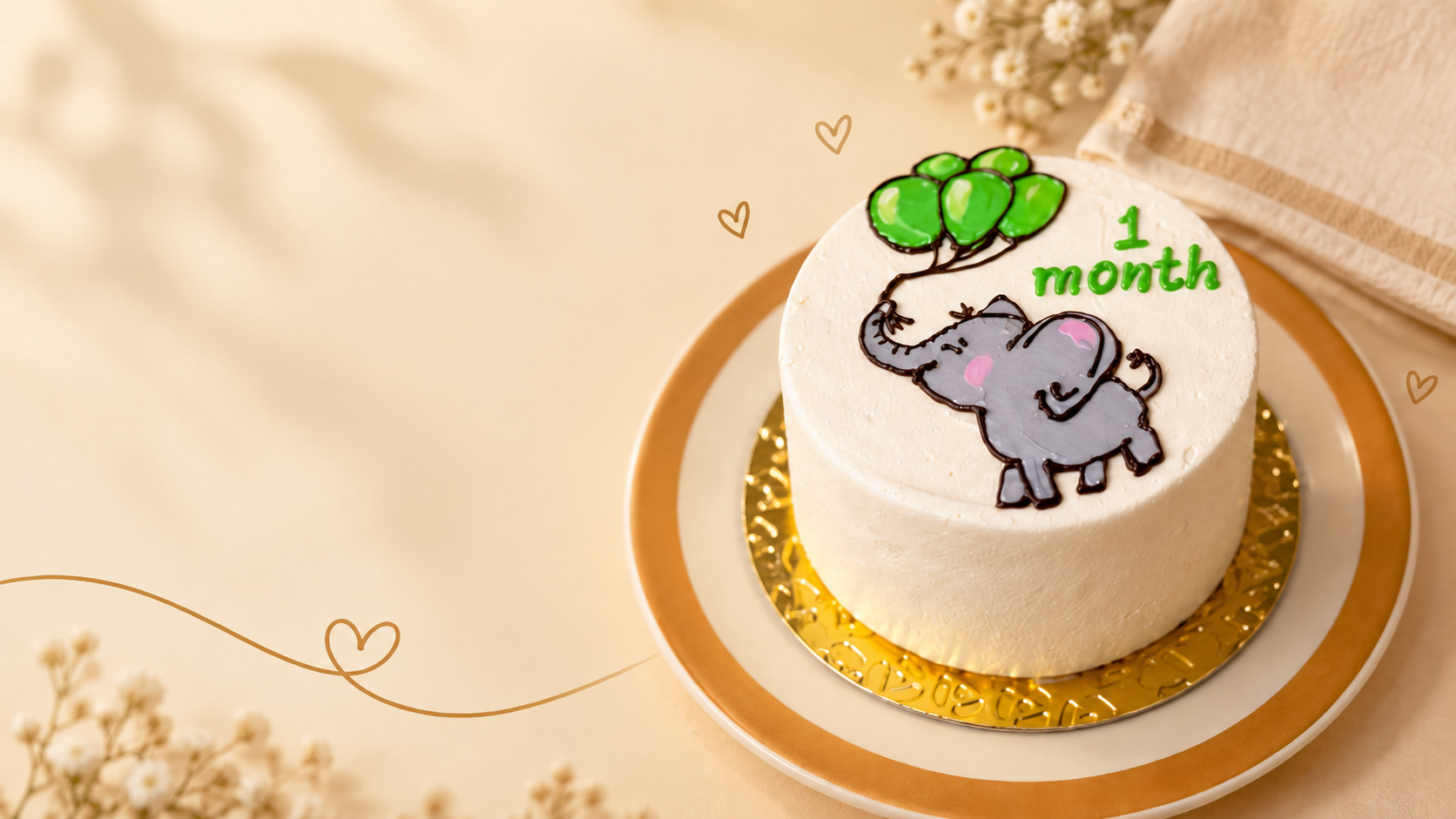 Bentô cake de mesversário com decoração de elefante e balões, marcando '1 month'